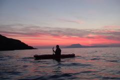 Sea kayaking at sunset In Ireland